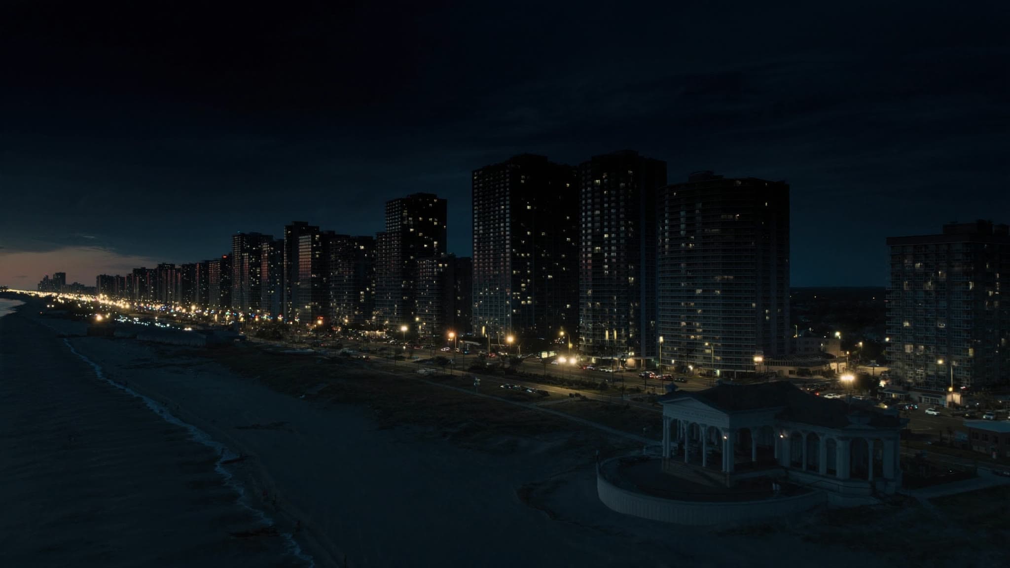 Revere at dusk: stylized artwork of Revere Beach and the boulevard, not a photograph