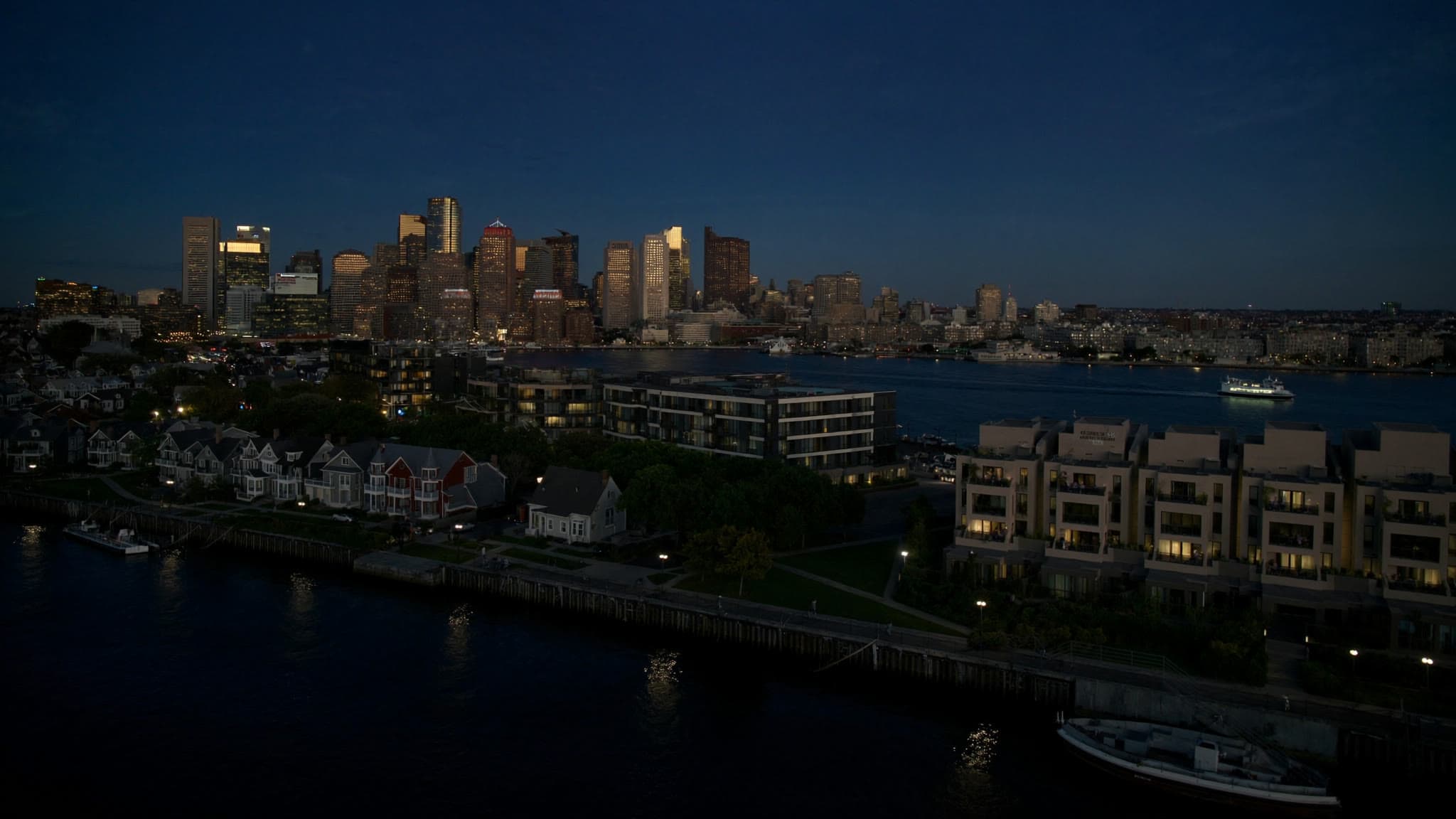 East Boston at dusk: stylized artwork of the skyline across the harbor, not a photograph
